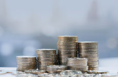 Stack of coins represent economic stability that affects hunger